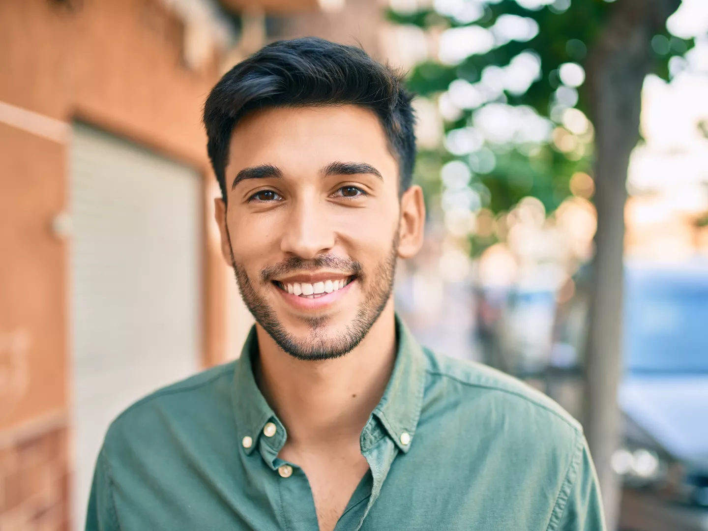 A man smiling enjoying outdoors.