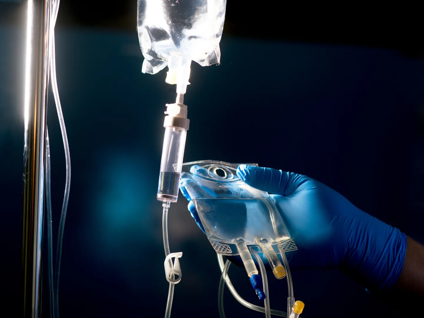 IV sedation being shown with a bag placed on a pole and dripping.