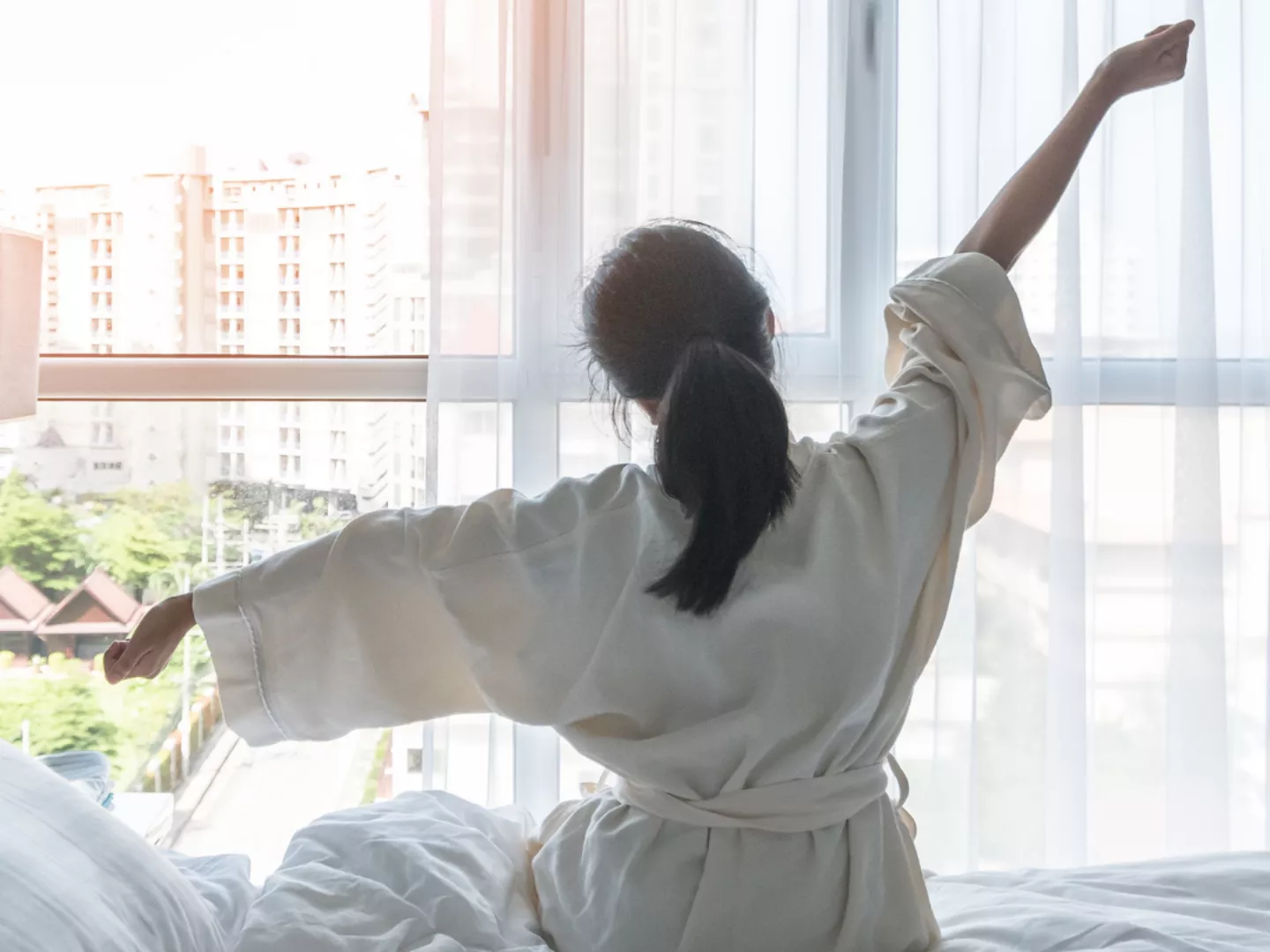 A woman wakes up refreshed.