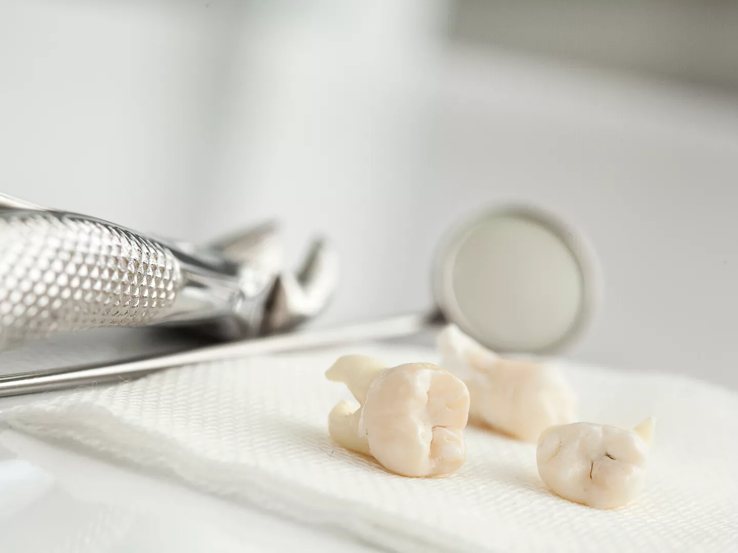 An instrument tray with teeth and tools after an extraction.